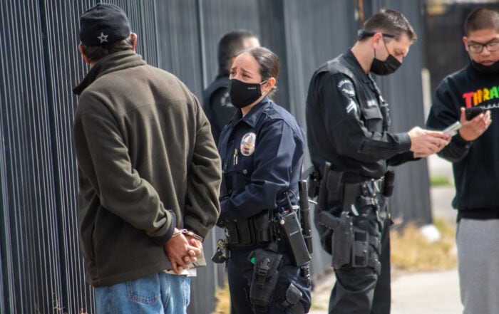 Northridge, California / USA - March 8, 2021: A diverse group of LAPD officers and supervisors respond to an assault investigation in Northridge, adjacent to a housing project on Parthenia.
